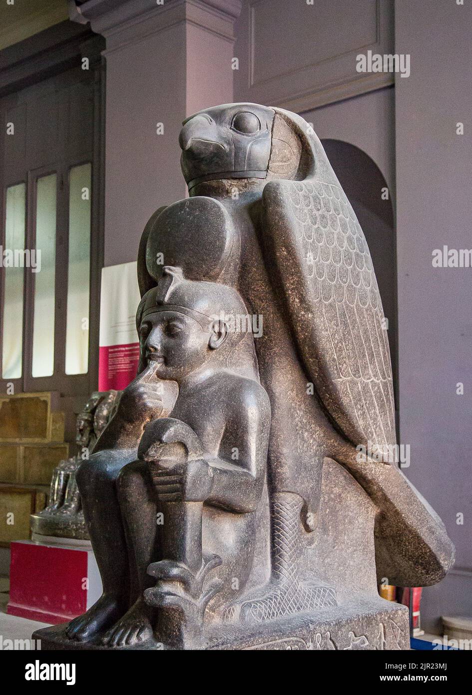Cairo, Egyptian Museum, Ramses 2 as a child, protected by the hawk god Horoun. Granite, from Tanis. Cryptographic name of the king : Ra Mess Sou. Stock Photo