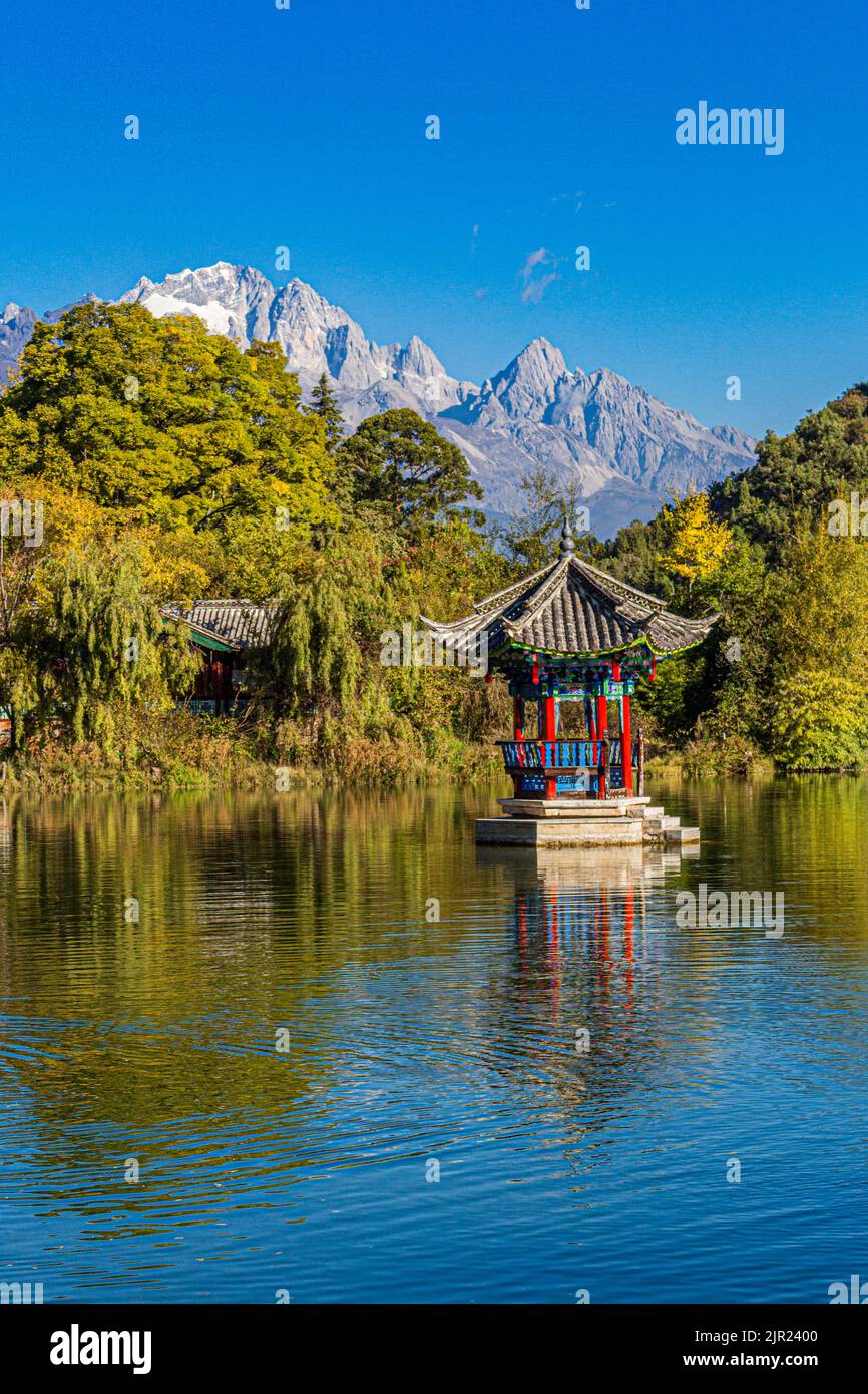 Near Old Town Lijiang is Jade Sprng Park with the Jade Dragon Snow Mountain, Moon Embracing Pagoda, Suocui Bridge and Black Dragon Pond in Yunnan... Stock Photo