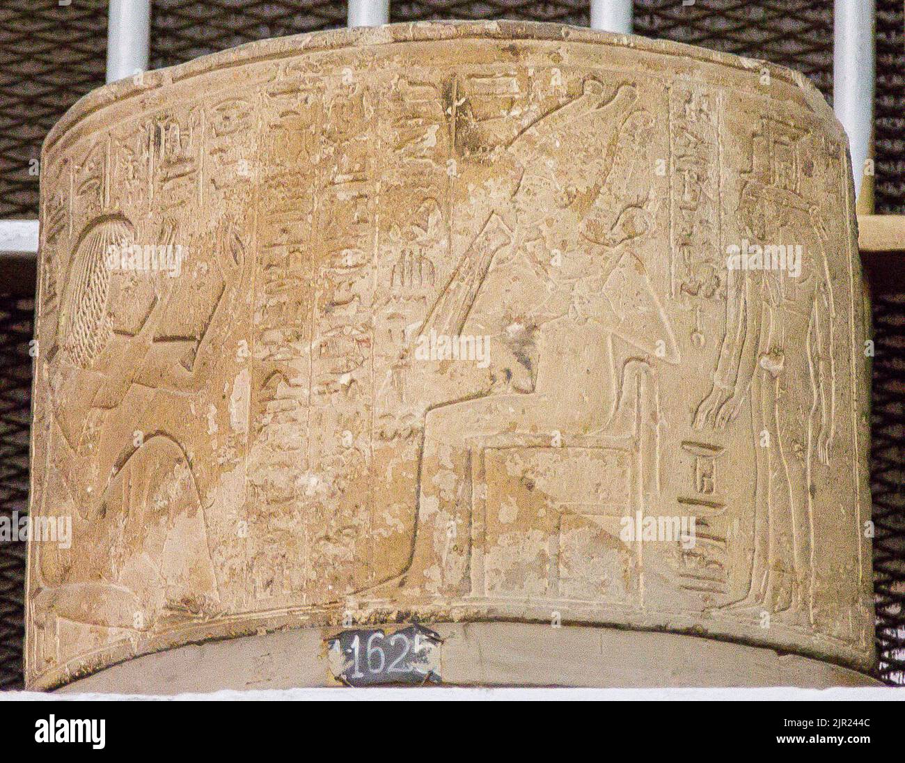 Egypt, Saqqara,  tomb of Horemheb,  block (now in Cairo museum) of a second court column : Horemheb praying Osiris-Unnefer, Isis and Nephthys. Stock Photo