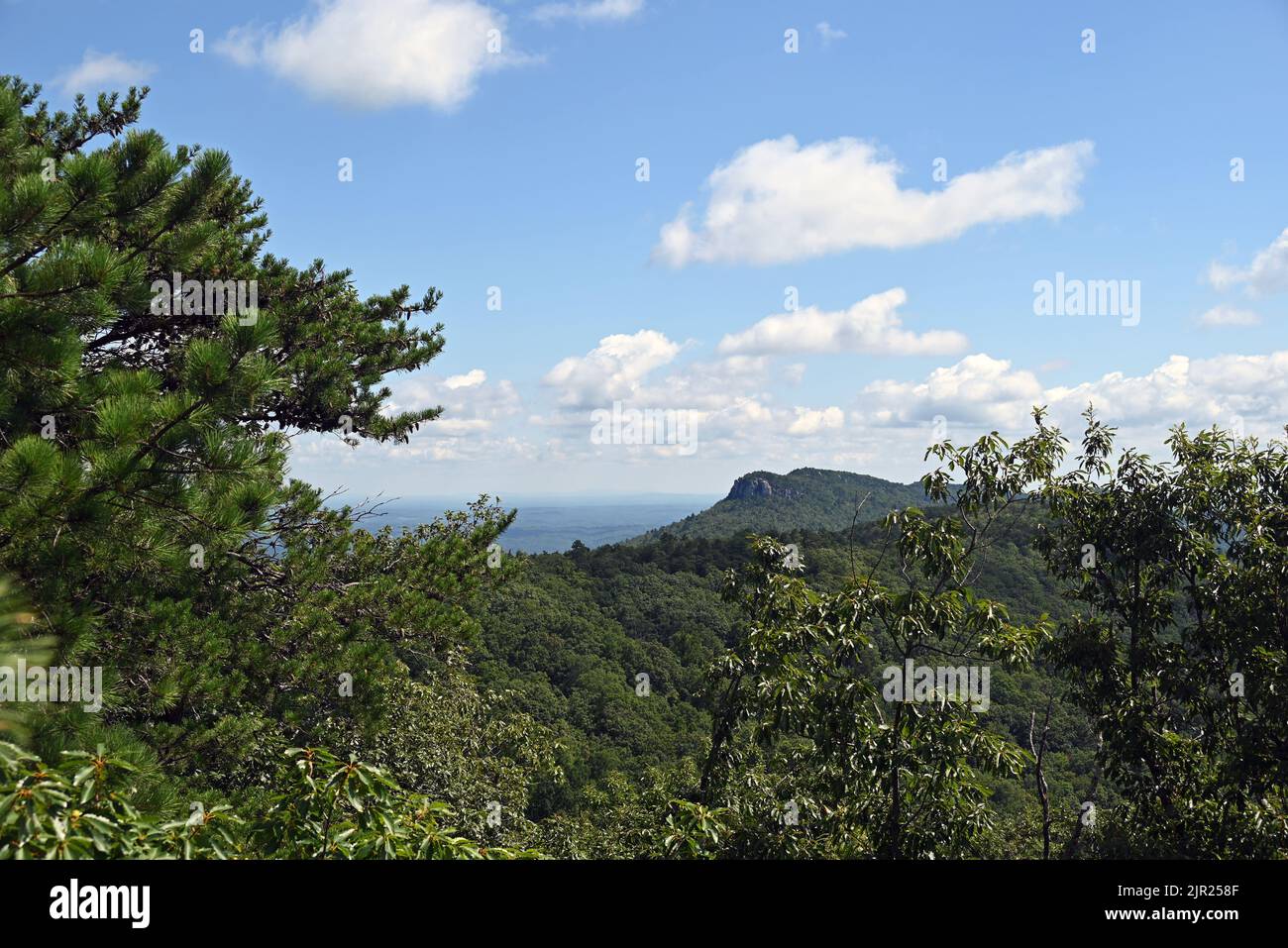 Hanging Rock overlook is visible in the distance from the opposite side of Hanging Rock State Park in North Carolina Stock Photo