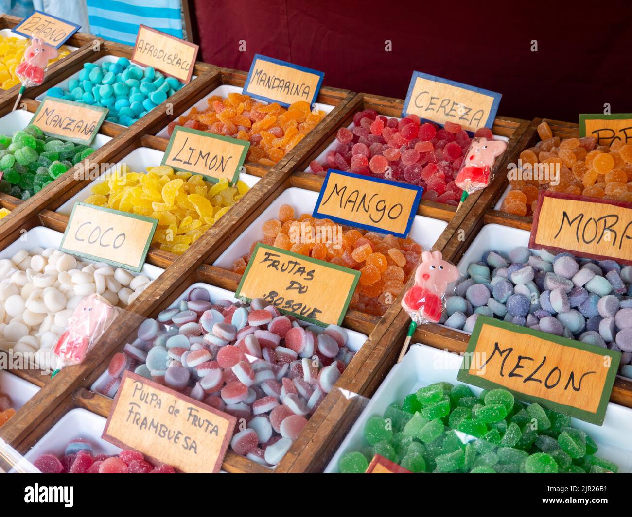 MONDONEDO, SPAIN - AUGUST 14, 2022: Colorful sweets with spanish labels at the medieval fair counter in the old town Mondonedo,Lugo,Galicia,Spain Stock Photo