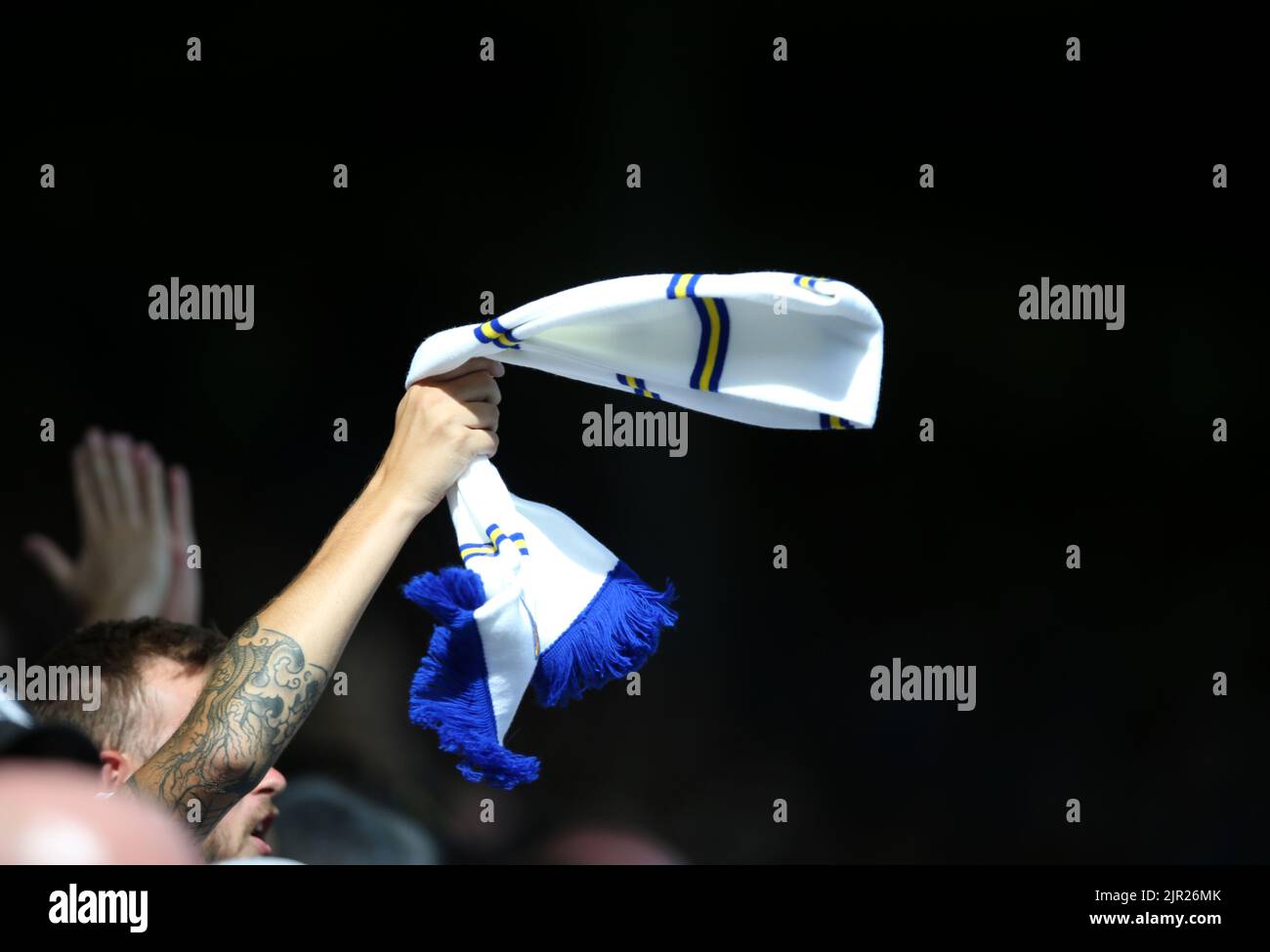 A Leeds United fan in the stands shows support during the Premier