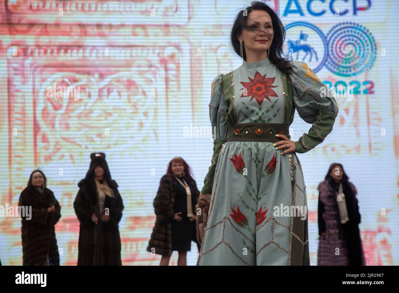 Moscow, Russia. 21st of August, 2022. Fashion show of dresses and fur coats by Yakut designers on a stage of the V Festival of the Russian Geographical Society in Zaryadye Park in the center of Moscow, Russia Stock Photo