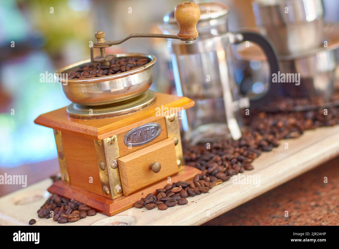 Still life with a vintage coffee grinder, coffee beans and other