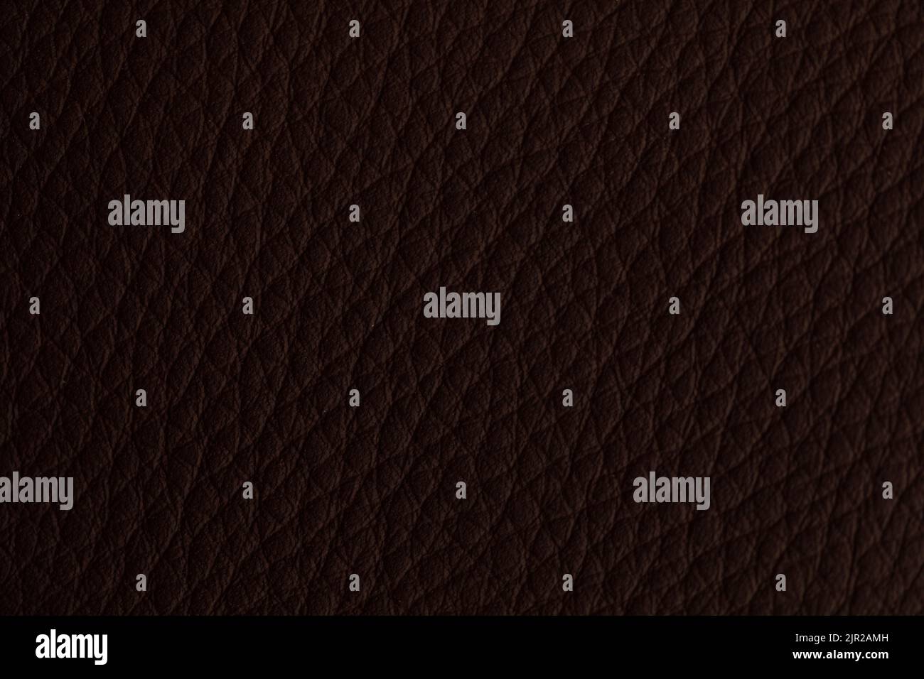 A brown leather background in closeup Stock Photo