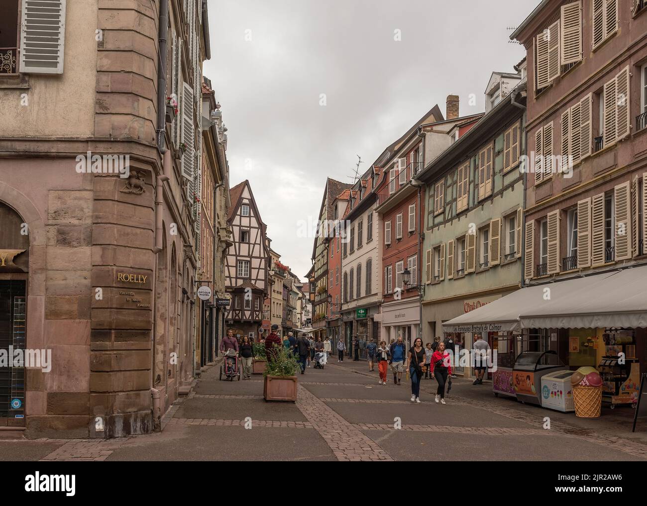 People on a pedestrian street in the historic center of Colmar, Alsace, France Stock Photo