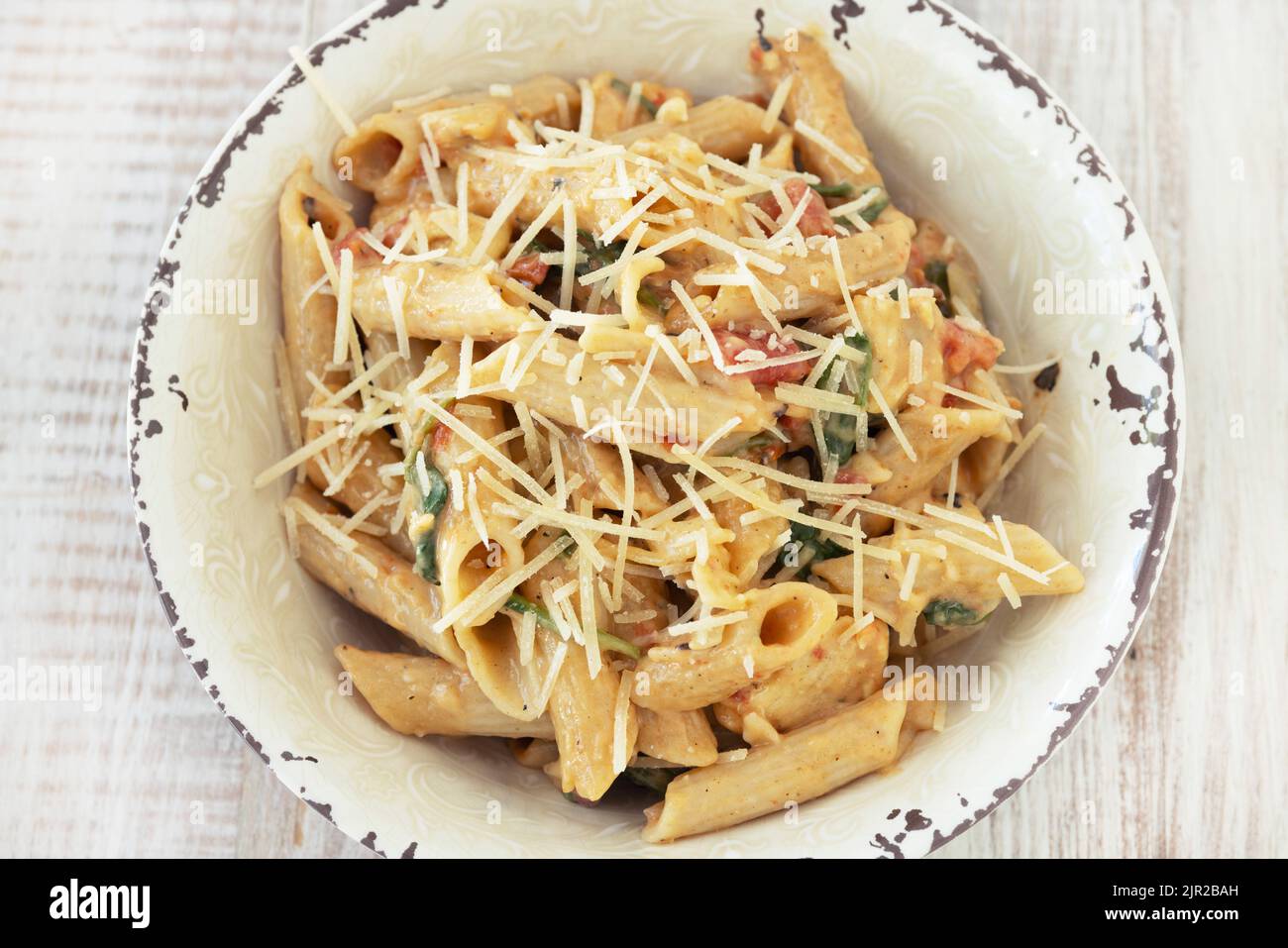 Delicious gluten free penne pasta dinner recipe with chicken, tomato