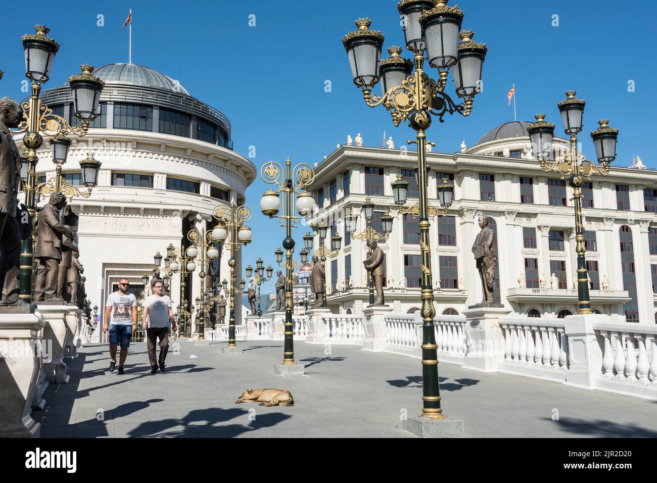 The art bridge across the Vandar river with the Financial Police Office and Foreign Ministery building in the background.Skopje, North Macedonia. Stock Photo