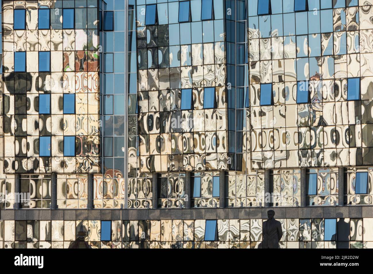 Reflection of the archaeological museum in the windows of the Telecom Building in Skopje, North Macedonia. Stock Photo