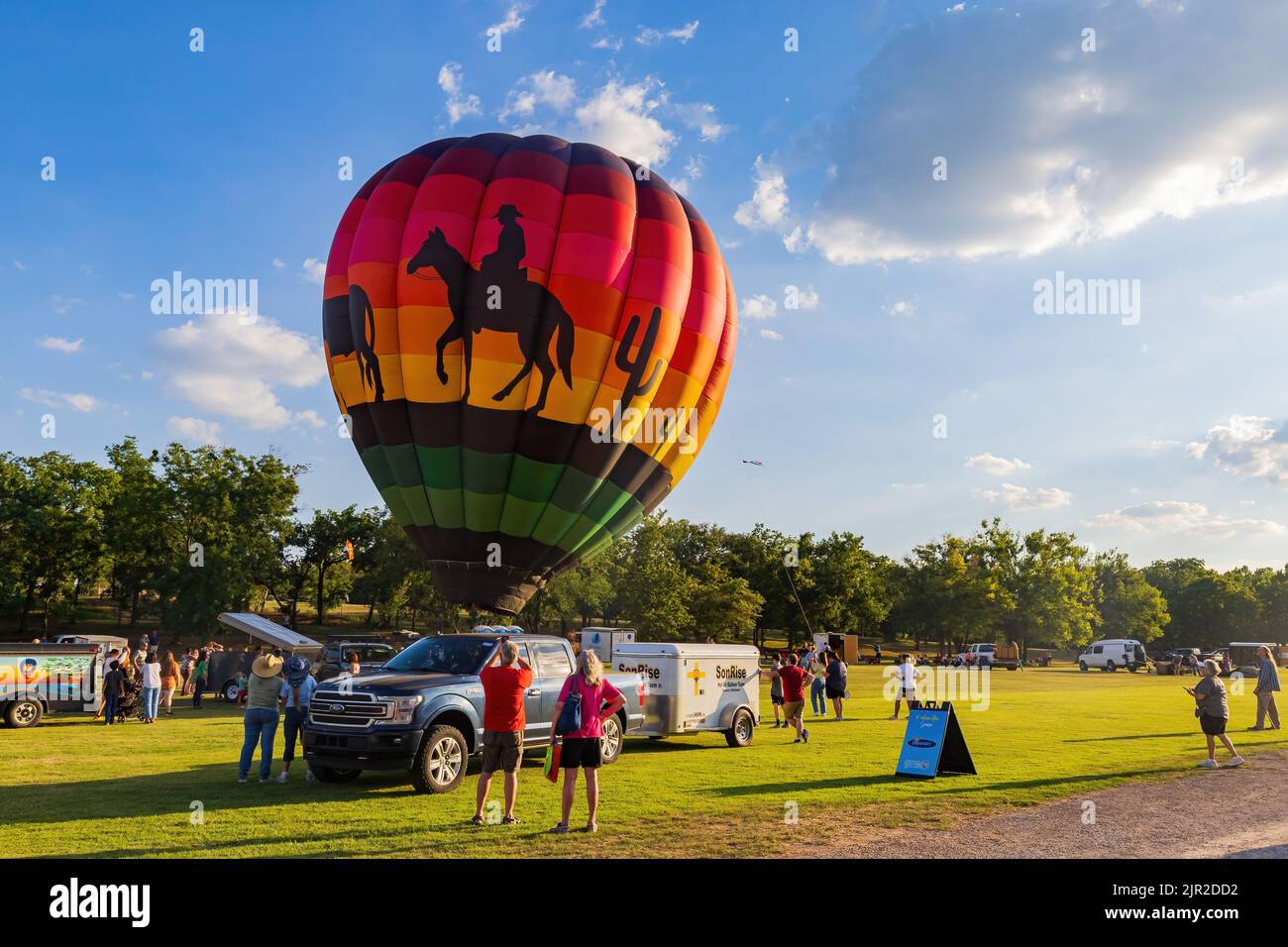 Oklahoma, AUG 12 2022 Cowboy art of a hot air balloon in the Firelake