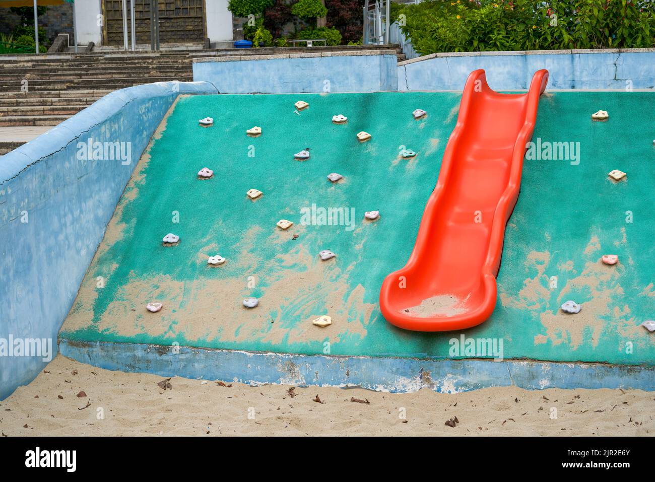 Play sand pool and slides in children's playground Stock Photo