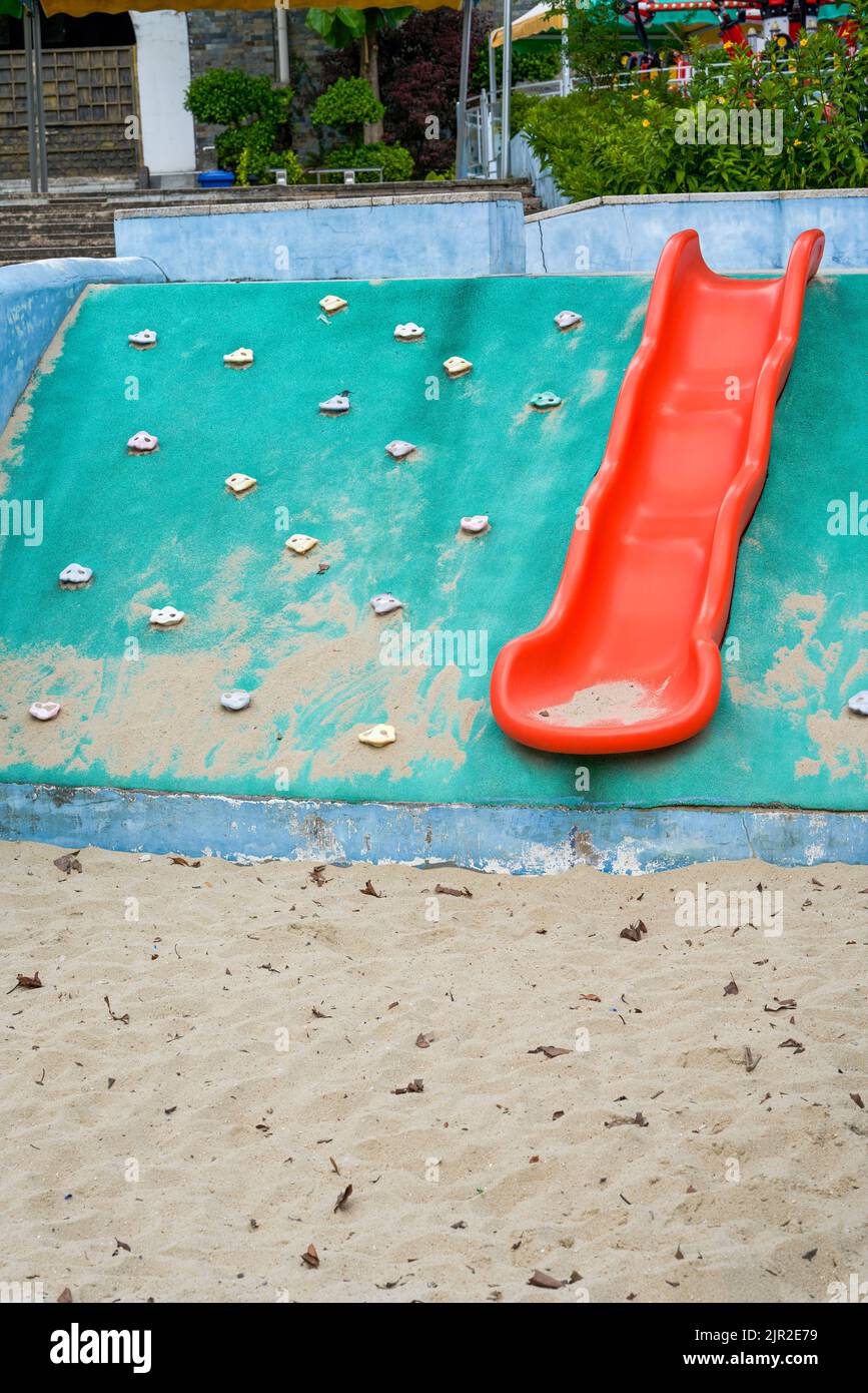 Play sand pool and slides in children's playground Stock Photo