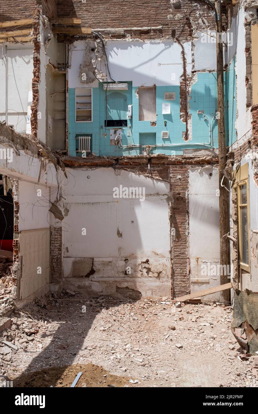 Barcelona, Catalonia, Spain, July 16, 2022: Demolition of old house reveals rooms on different floors, real estate speculation Stock Photo