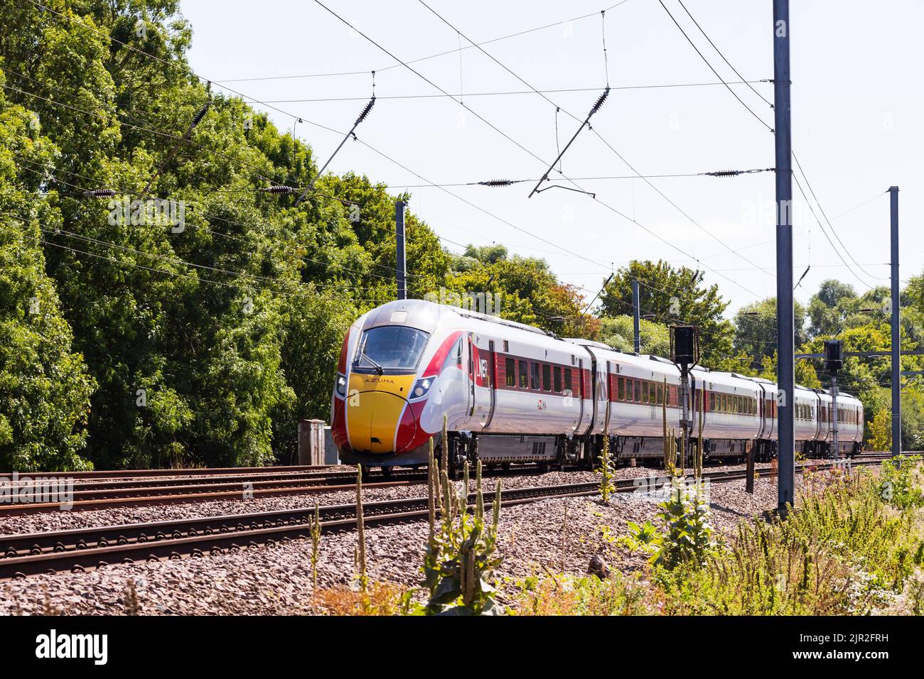 Azuma diesel electric train of the London North Eastern Railway, LNER, passes Offord Cluny on the East Coast Main Line, heading North. Stock Photo