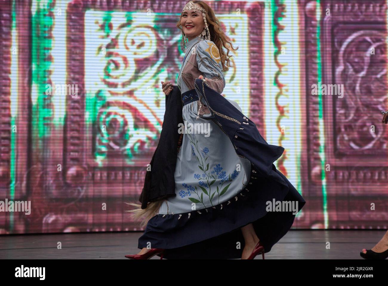Moscow, Russia. 21th of August, 2022. Fashion show of dresses and fur coats by Yakut designers on a stage of the V Festival of the Russian Geographical Society in Zaryadye Park in the center of Moscow, Russia Stock Photo