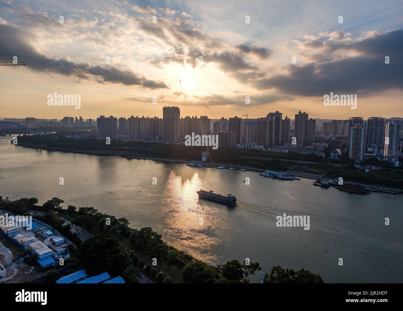 The city riverside architectural landscape and the sand ship passing by ...