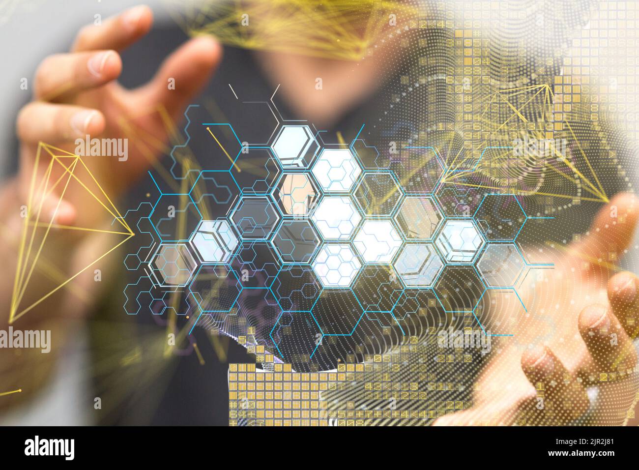 The hands holding a hexagonal hologram. Technology, data Stock Photo ...