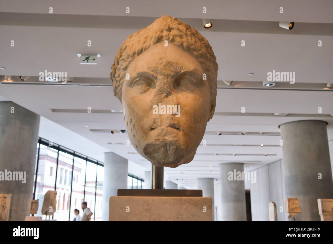 Big head of a statue of Artemis Brauronia inside the Acropolis museum in Athens Stock Photo