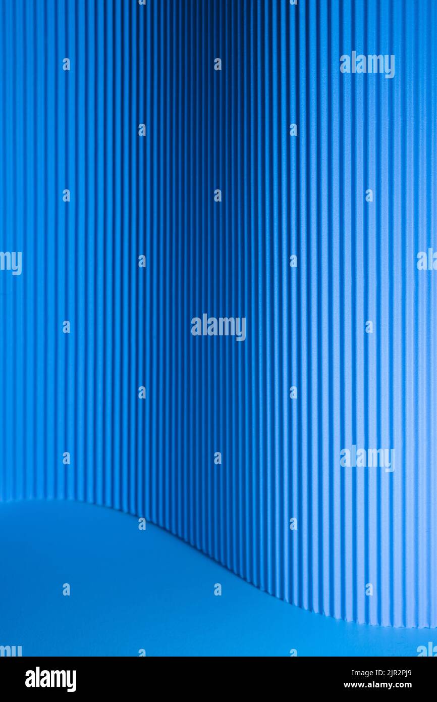 Corrugated lines background. with blue hues light. Futuristic abstract backdrop Stock Photo