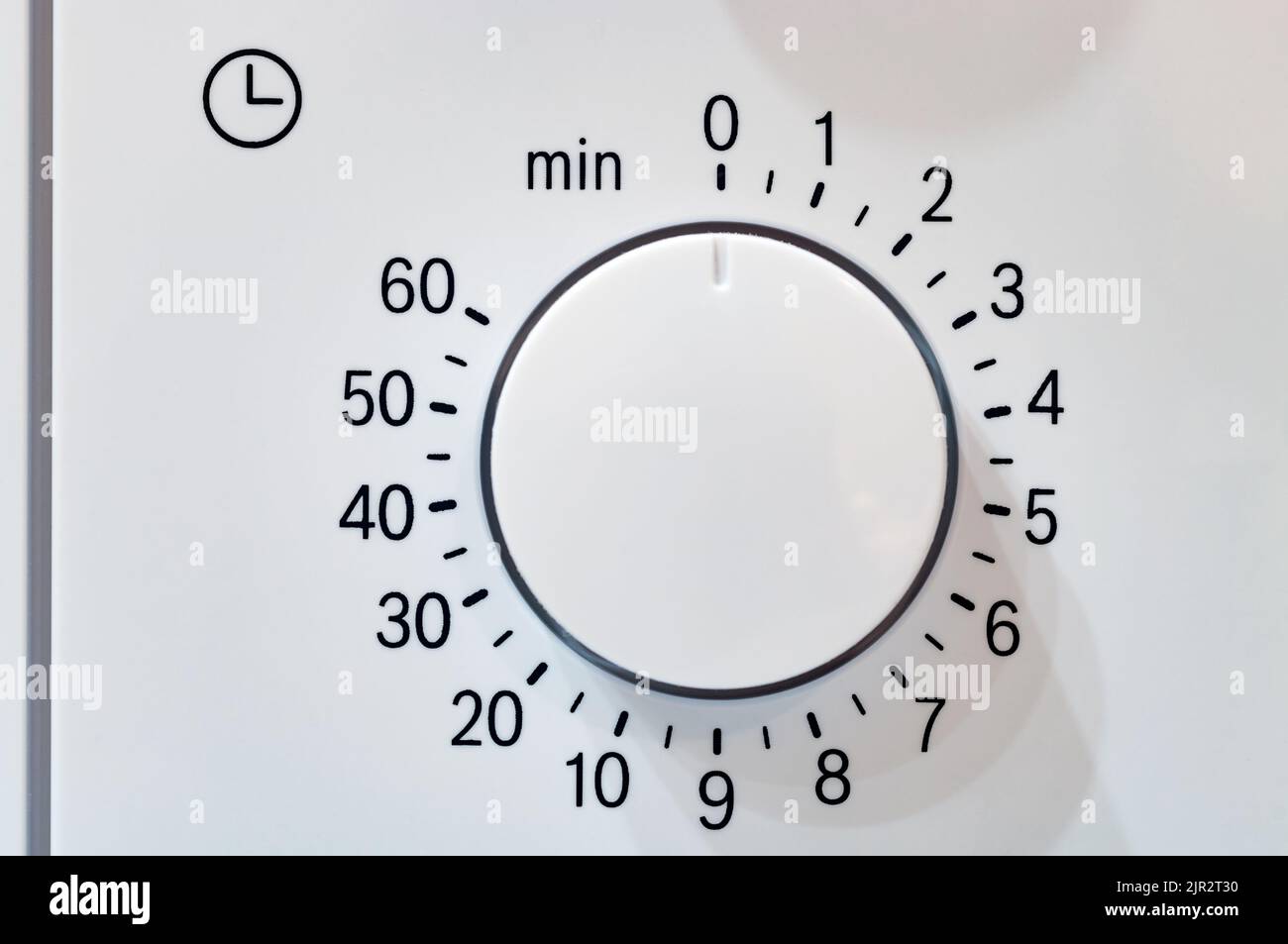 Microwave oven circular timer for one hour, analogue white Stock Photo