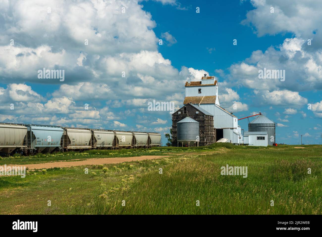 The grain storage elevator and train cars at Bromhead, Saskatchewan