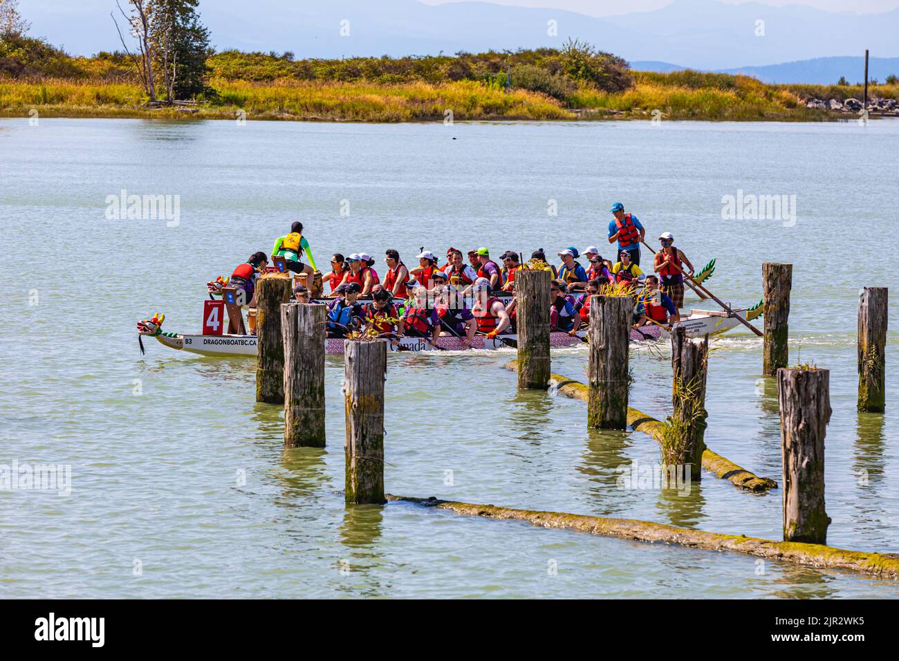 Dragon Boat teams making their way to the starting line at the 2022 Steveston Dragon Boat Festival in British Columbia Canada Stock Photo