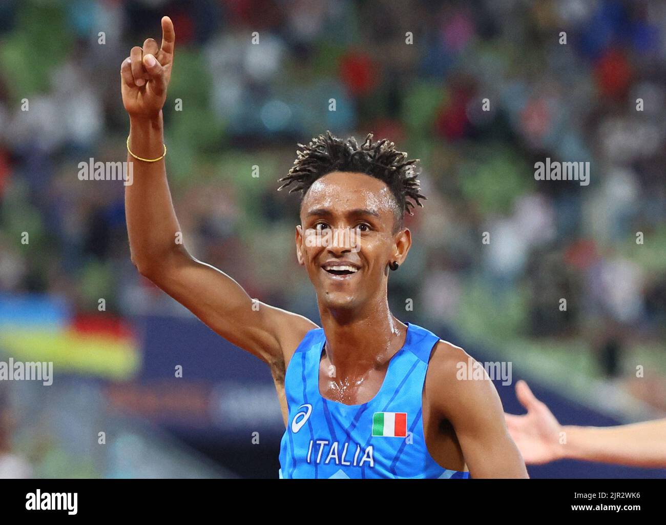 2022 European Championships - Athletics - Olympiastadion, Munich, Germany - August 21, 2022 Italy's Yemaneberhan Crippa celebrates after winning gold in the men's 10,000m final REUTERS/Wolfgang Rattay  REFILE - CORRECTING ID Stock Photo