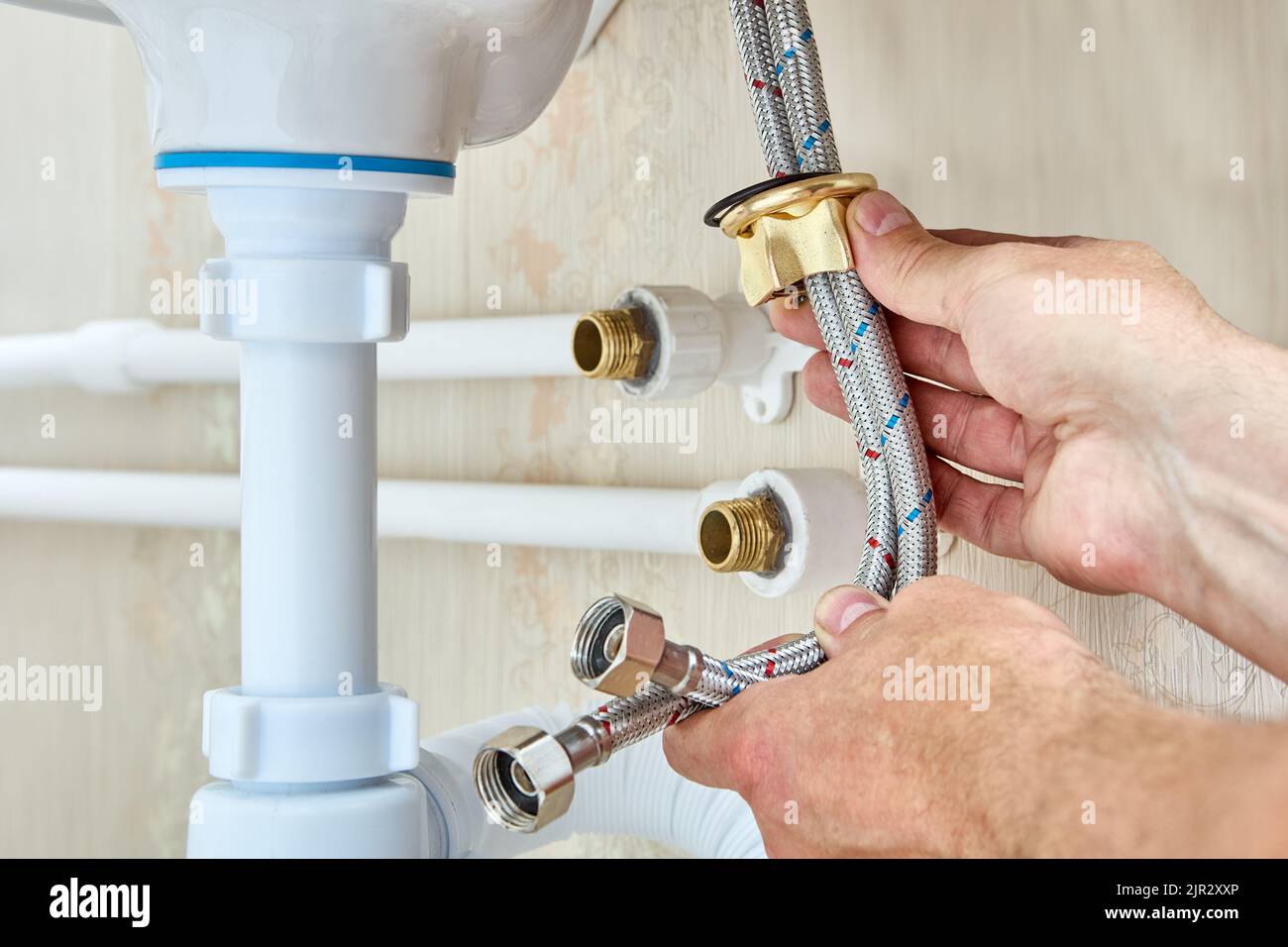 Connected faucet to sink by using braided water hoses and to home water