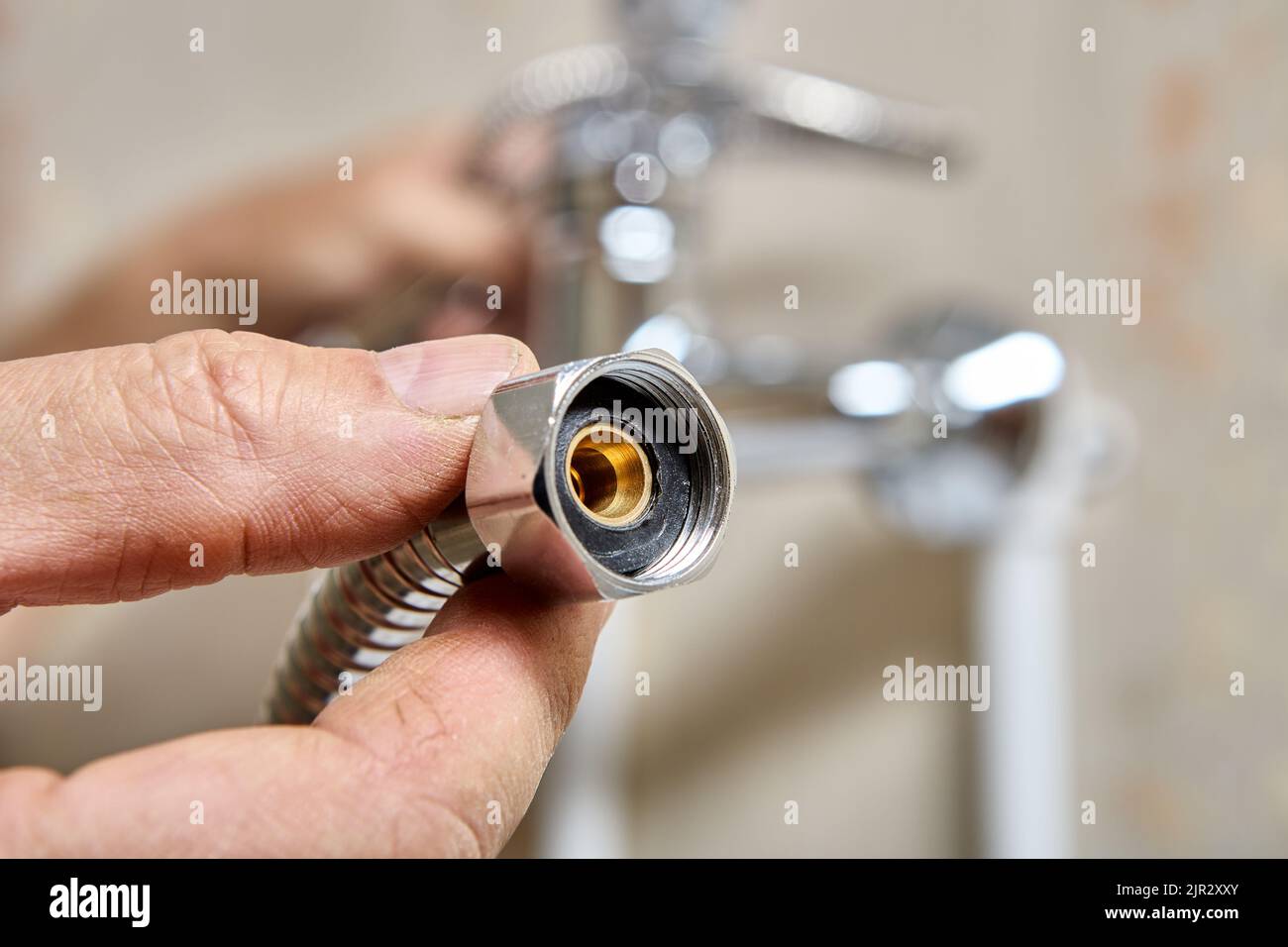 Flexible hose for shower head, plumber replaced rubber gasket seal to