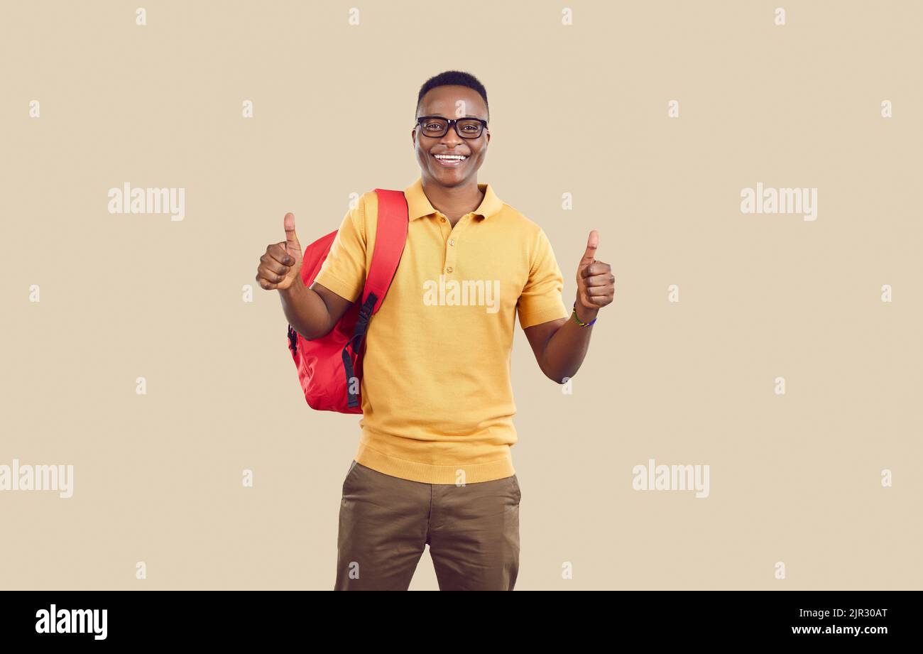 Happy successful African American university student showing thumbs up ...