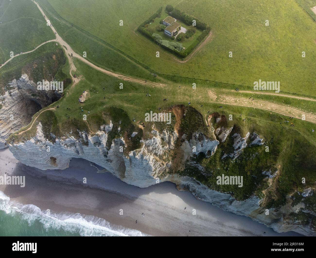 Aerian view on chalk cliffs near Porte d'Aval arch in Etretat on green ...