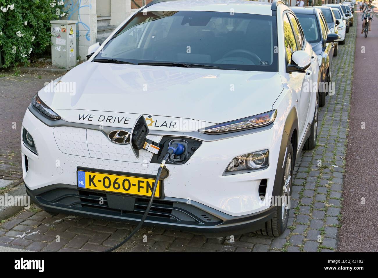 Utrecht, Netherlands August 2022 Cable plugged in to recharge an