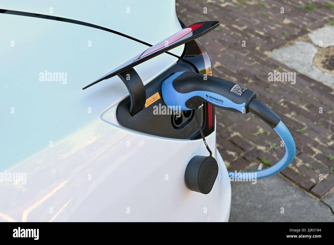 Utrecht, Netherlands August 2022 Cable plugged in to recharge a