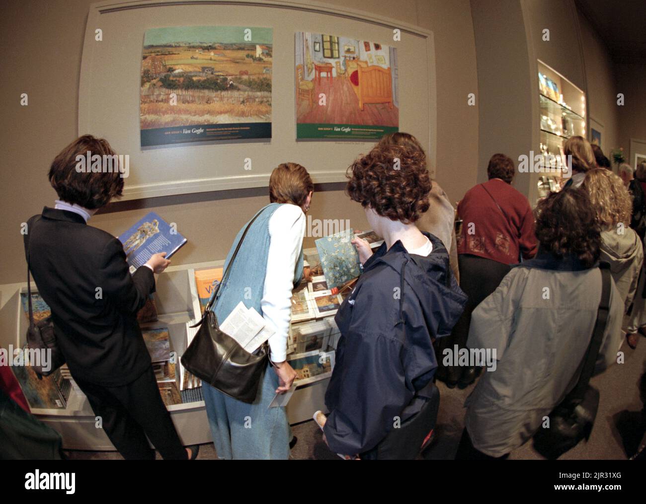 People crowd the gift shop to purchase items during the largest exhibit of artworks by the painter Vincent Van Gogh in 25-years at the National Gallery of Art, October 9, 1998 in Washington, DC. More than 70 masterpieces are on loan from the Van Gogh Museum in Amsterdam for the exhibition. Stock Photo
