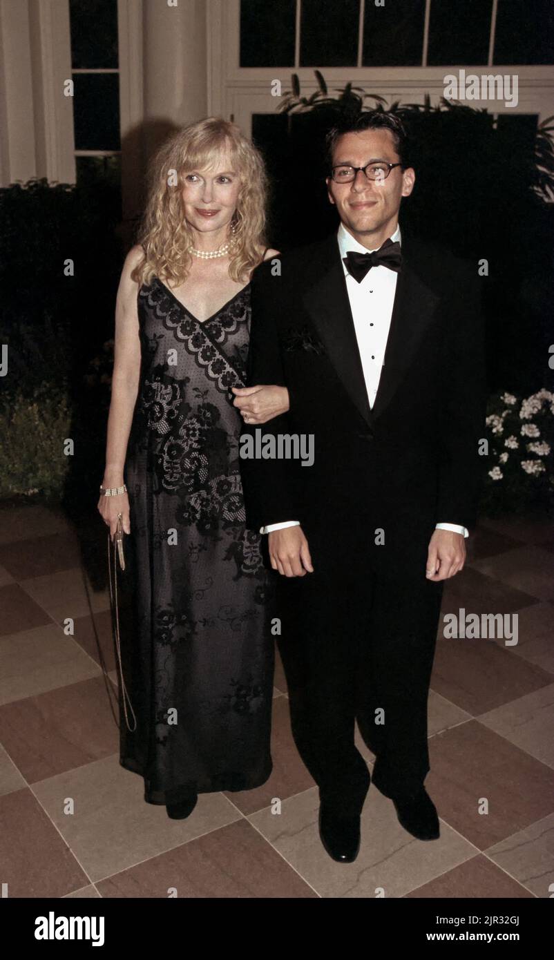 Actress Mia Farrow escorted by son Matthew Previn arrive for a State Dinner welcoming Czech President Vaclav Havel  to the White House, September 16, 1998 in Washington, D.C. Stock Photo