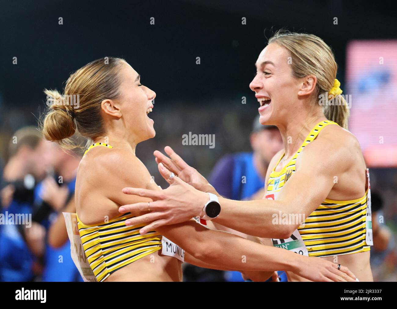 2022 European Championships - Athletics - Olympiastadion, Munich, Germany - August 21, 2022 Germany's Rebekka Haase and Alexandra Burghardt celebrate after winning gold in the women's 4 x 100m final REUTERS/Wolfgang Rattay Stock Photo
