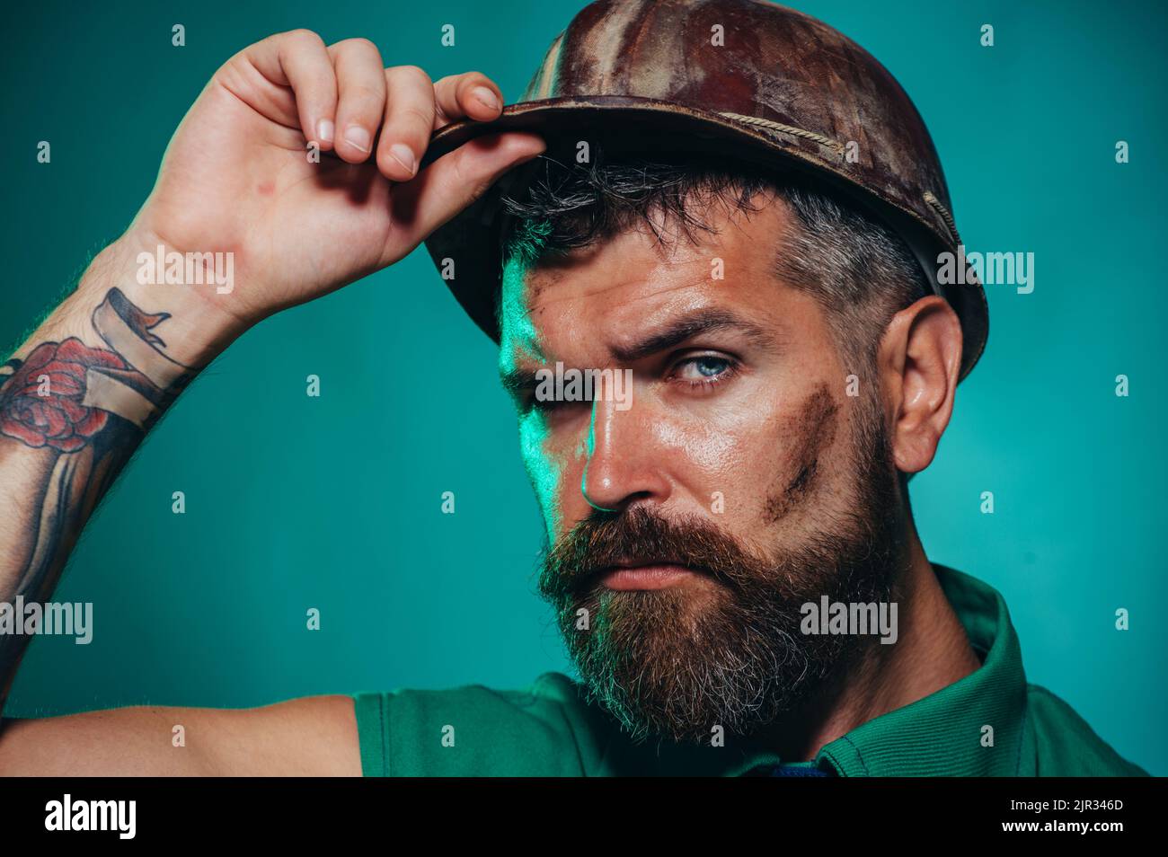 Male builder in hard hat. Construction worker in safety helmet