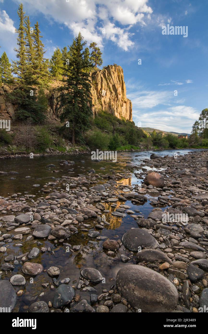 A granite formation glows golden in the fading sunlight as its