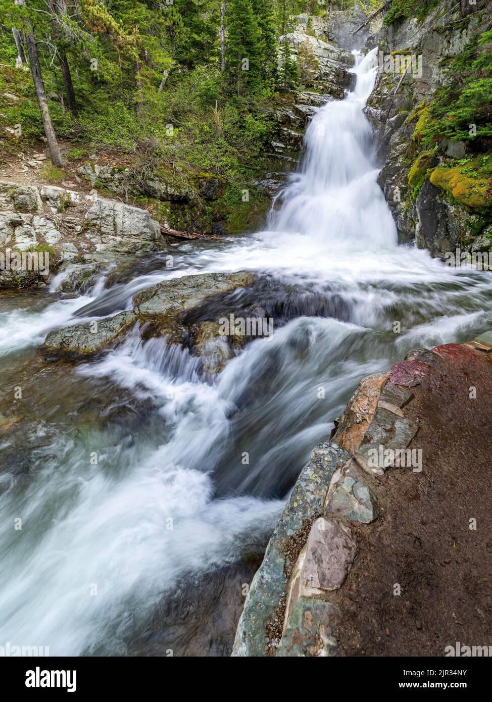 Beautiful waterflow during spring runoff cascades over the rocks Stock Photo