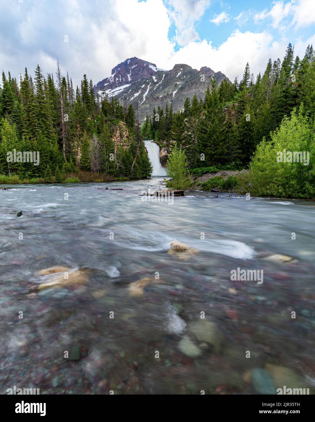 Glacier Montana waterfall with river flowing by Stock Photo