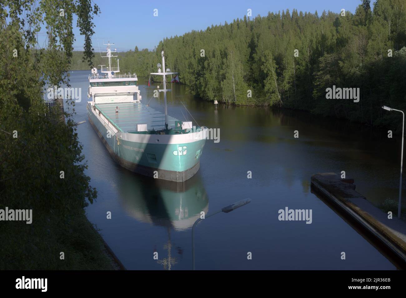 Cargo ship Marietje Hester pass the lock of Saimaa canal connecting Saimaa lake, Finland with Gulf of Finland of Baltic sea at Vyborg, Russia Stock Photo