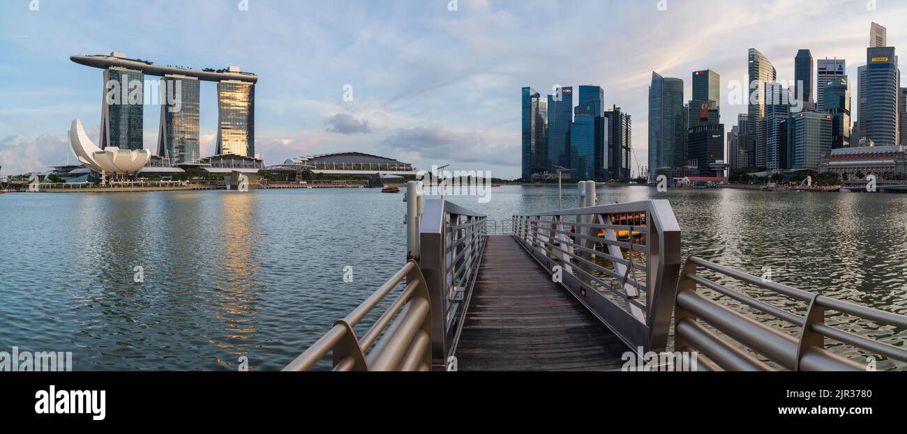 SINGAPORE, MAY 11, 2017; Singapore skyline at sunset with Singapore skyscrapers. City view from the pier Stock Photo
