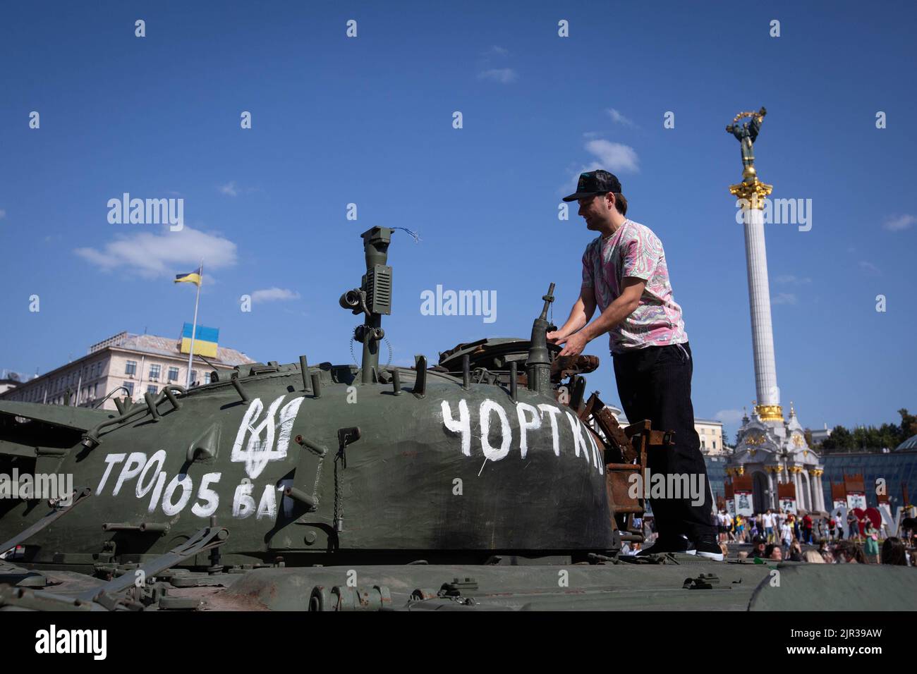 A man looks at a destroyed Russian tank displayed on the main street Khreshchatyk as part of the upcoming celebration of the Independence Day of Ukraine amid Russia's invasion of Ukraine in central Kyiv. Stock Photo