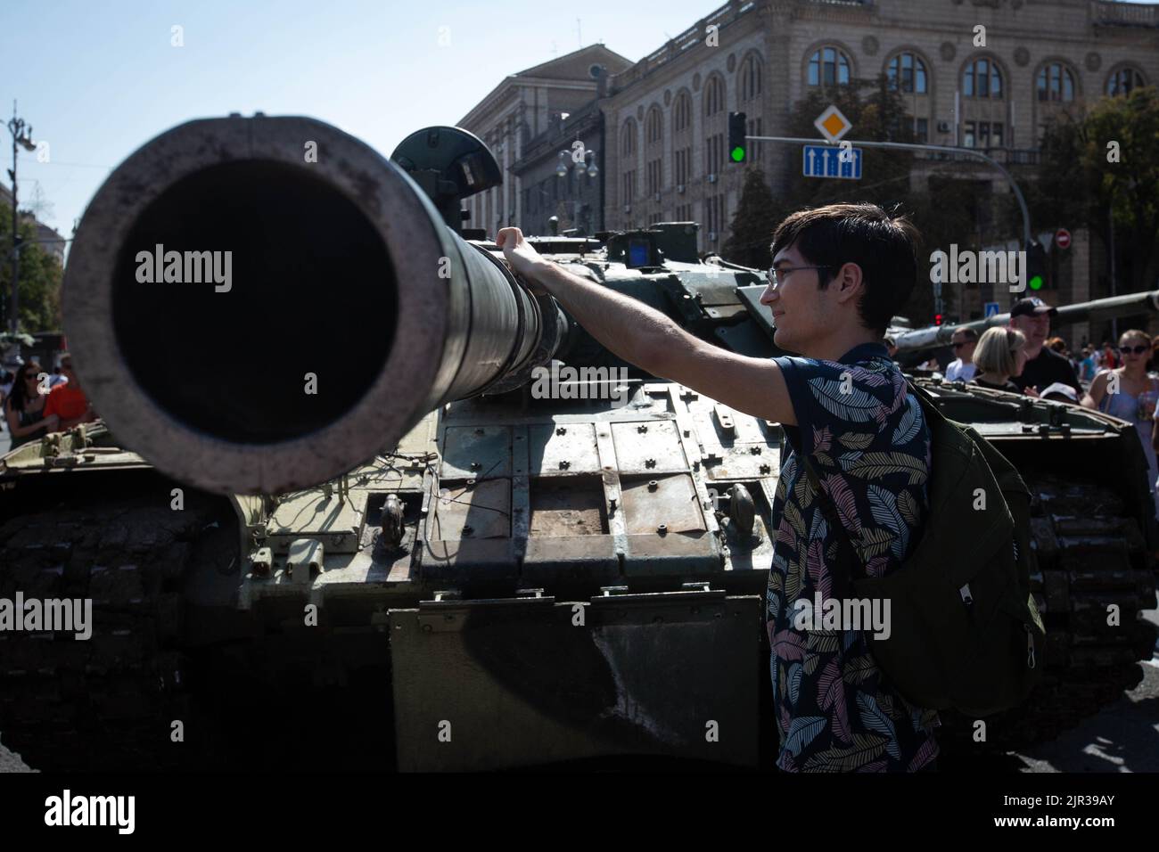 A boy touches a destroyed Russian tank displayed on the main street Khreshchatyk as part of the upcoming celebration of the Independence Day of Ukraine amid Russia's invasion of Ukraine in central Kyiv. Stock Photo