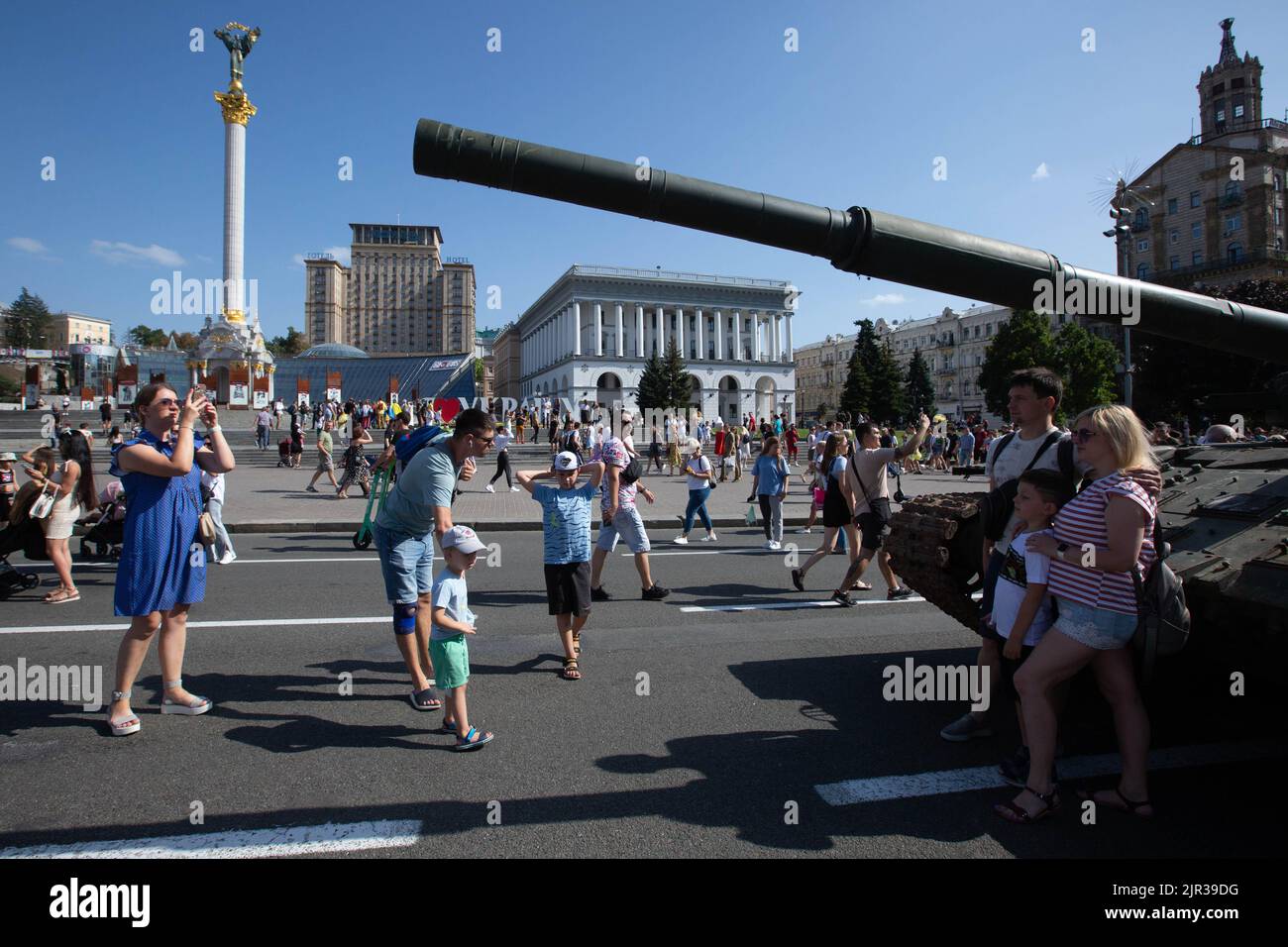 People take photos in front of a destroyed Russian tank displayed on the main street Khreshchatyk as part of the upcoming celebration of the Independence Day of Ukraine amid Russia's invasion of Ukraine in central Kyiv. Stock Photo