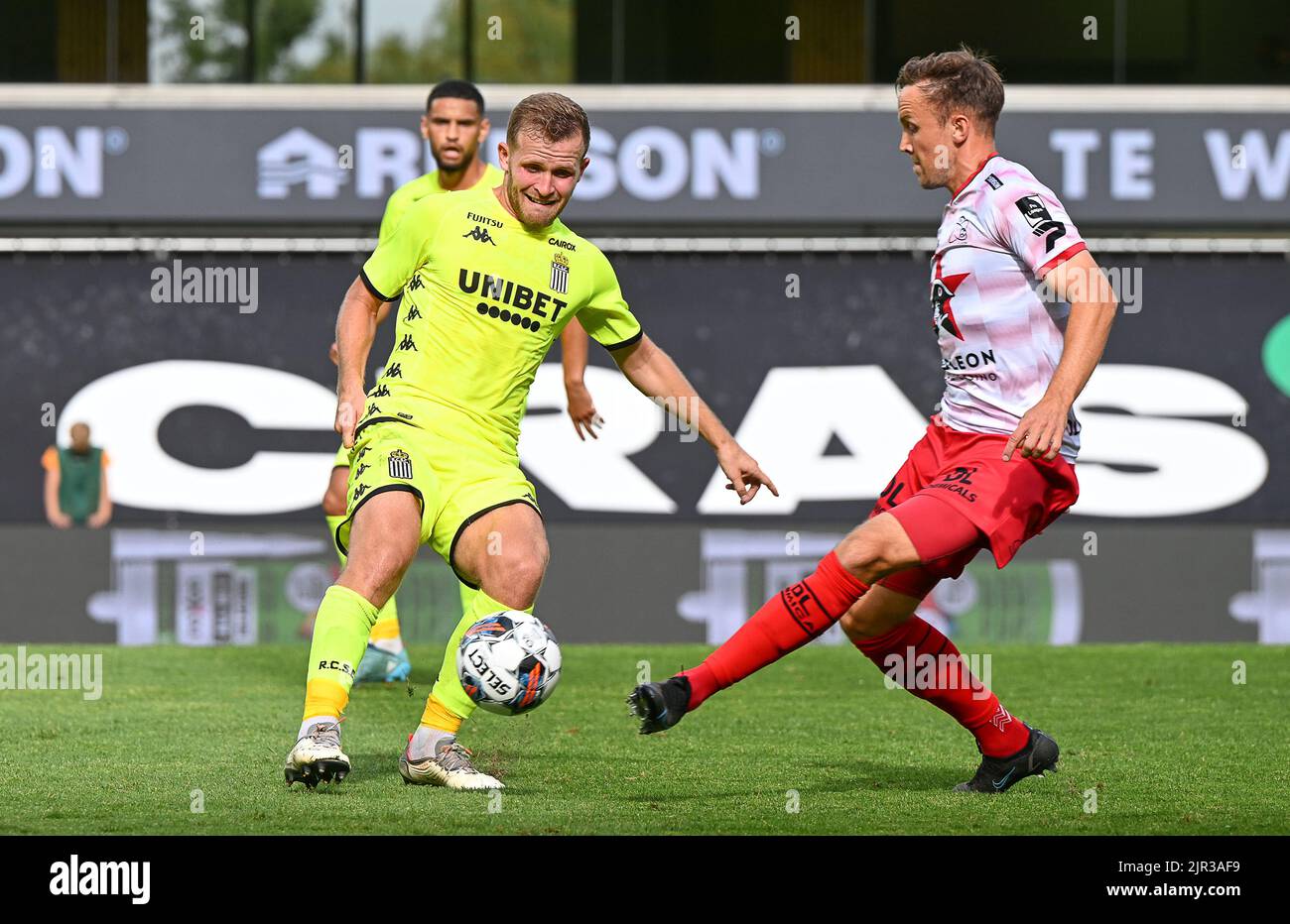 Waregem, Belgium, 21/08/2022, Charleroi's Jonas Bager and Essevee's Vigen Christensen Lasse fight for the ball during a soccer match between SV Zulte-Waregem and Sporting Charleroi, Sunday 21 August 2022 in Waregem, on day 5 of the 2022-2023 'Jupiler Pro League' first division of the Belgian championship. BELGA PHOTO DAVID CATRY Stock Photo