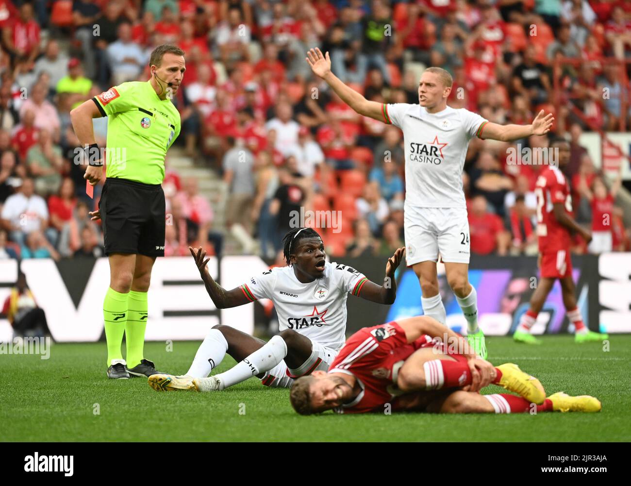 Liege, Belgium, 21 August 2022, OHL's Nachon Nsingi receives a red card from, referee Nathan
