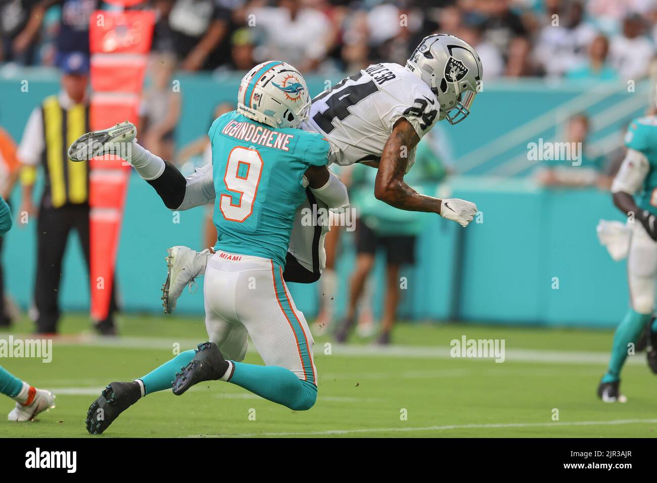 Miami. FL USA; Miami Dolphins cornerback Noah Igbinoghene (9) tackles Las Vegas Raiders wide