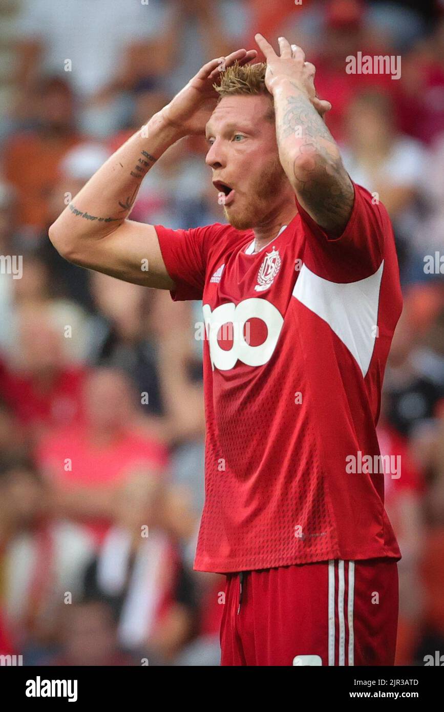 Liege, Belgium, 21 August 2022, Standard's Renaud Emond looks dejected
