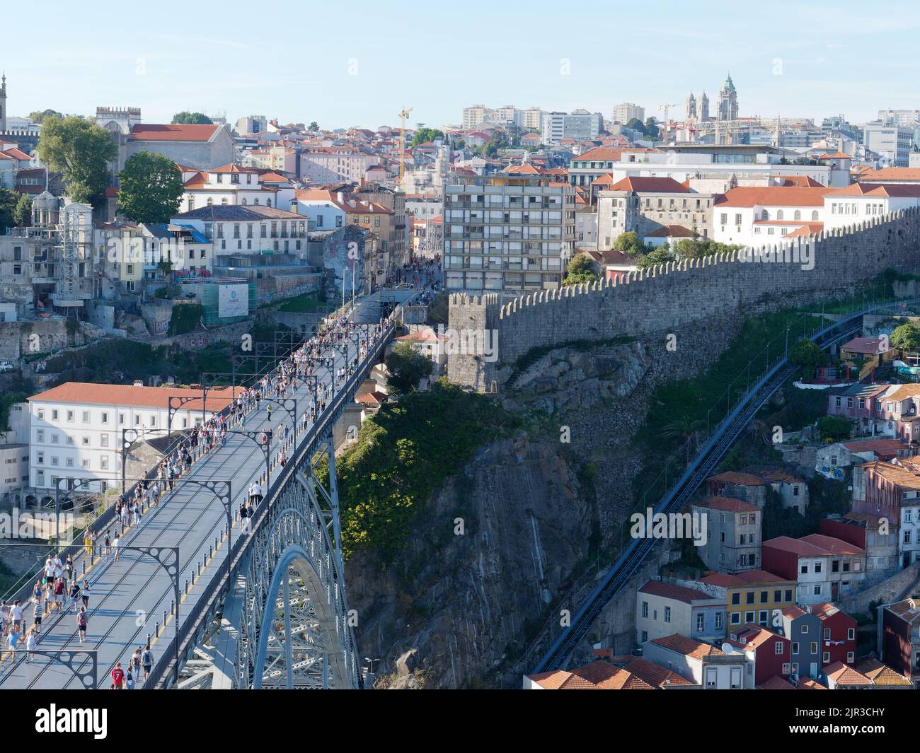 Elevated view over Porto. Portugal, with Luis I bridge left and the historic walls and funicular track right Stock Photo
